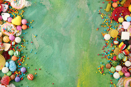 candies with jelly and sugar. colorful array of different childs sweets and treatsの写真素材