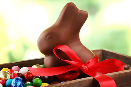 Chocolate Easter eggs and chocolate bunny and colorful sweets