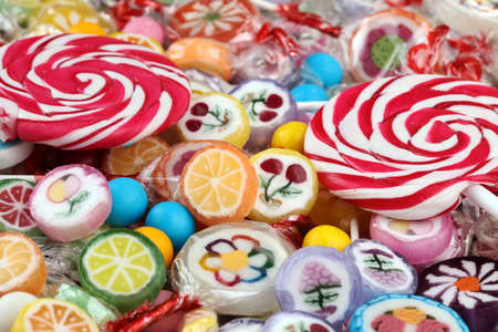 candies with jelly and sugar. colorful array of different childs sweets and treatsの写真素材