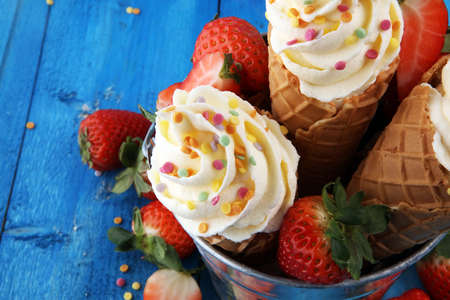 Vanilla frozen yogurt or soft ice cream in waffle coneの写真素材