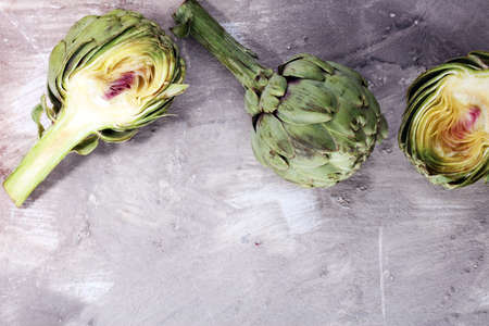 artichokes on grey background. fresh organic artichoke flowerの写真素材