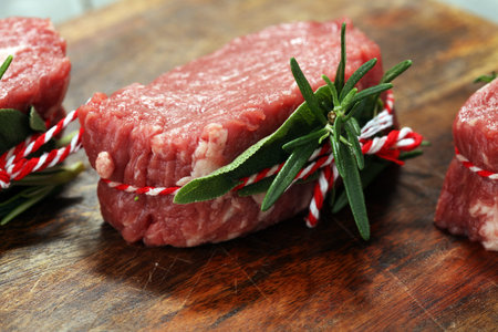 Raw beef fillet steaks with spices for bbq grilling 