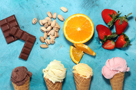 Set of ice cream scoops of different colors and flavours with berries, nuts and fruits の写真素材
