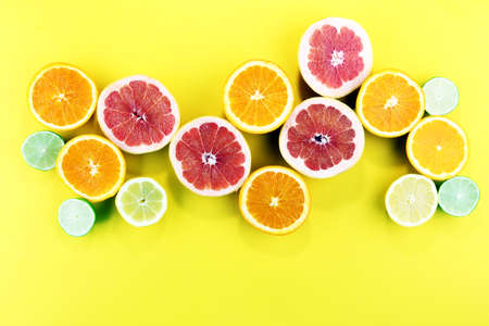 Citrus fruits with orange, lemon, grapefruit and lime on light backgroundの写真素材