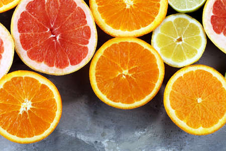 Citrus fruits with orange, lemon, grapefruit and lime on light backgroundの写真素材