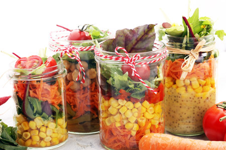Homemade salad in glass jar with vegetables. Healthy food, diet, detox, clean eating and vegetarian...