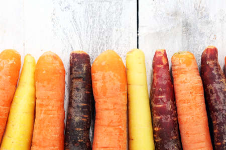 pile of carrots. Crate of mixed fresh harvested colorful carrotの写真素材