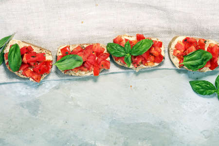 fresh tomato bruschetta. italian food appetizer with basil.の写真素材