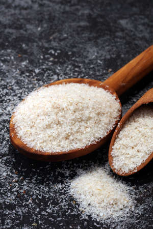 Portion of Psyllium Seeds on rustic dark background. Psyllium seed husks.の写真素材