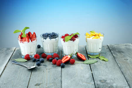 Yogurt and berry. Fresh fruit yogurt with fresh berries and peaches.の写真素材