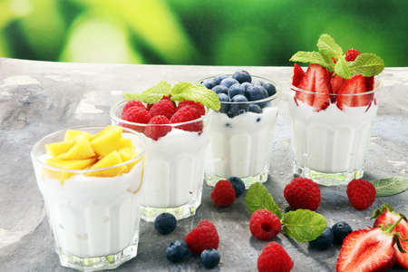 Yogurt and berry. Fresh fruit yogurt with fresh berries and peaches.