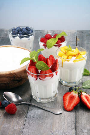 Yogurt and berry. Fresh fruit yogurt with fresh berries and peaches.の写真素材