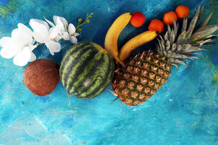 Tropical fruits background with pineapple, banana, coconut and watermelon.の写真素材