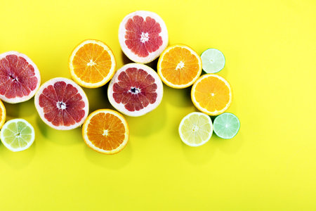 Citrus fruits with orange, lemon, grapefruit and lime on light background