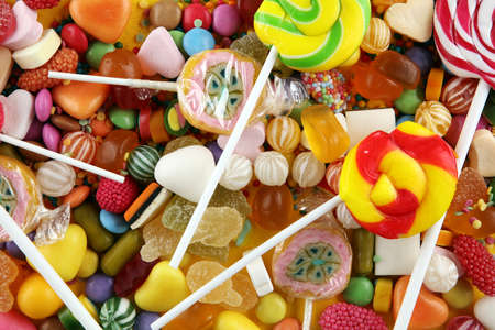 candies with jelly and sugar. colorful array of different childs sweets and treatsの写真素材