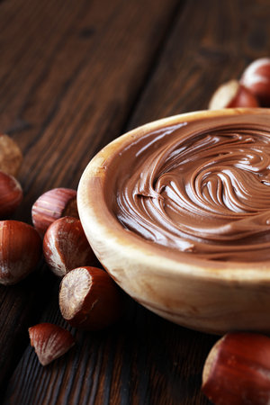 Homemade hazelnut spread in wooden bowl. Hazelnut Nougat cream.の写真素材