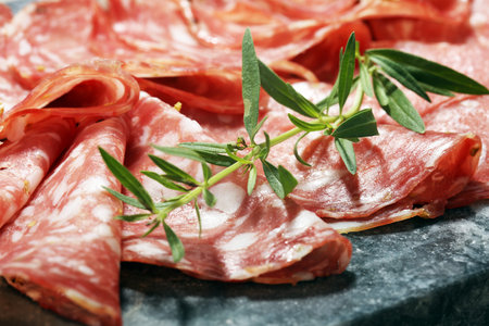 thinly sliced salami . delicious snack rustic salami.