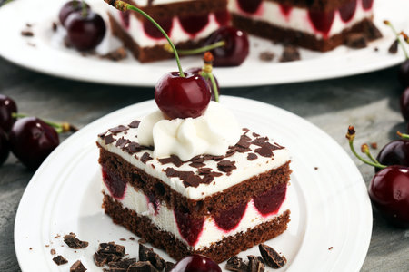 Chocolate cake with cherries and whipped cream. Black Forest cake.