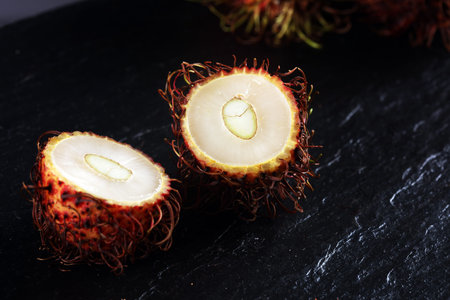 Rambutans fruit with leaf on table. Rambutan or hairy lychee.