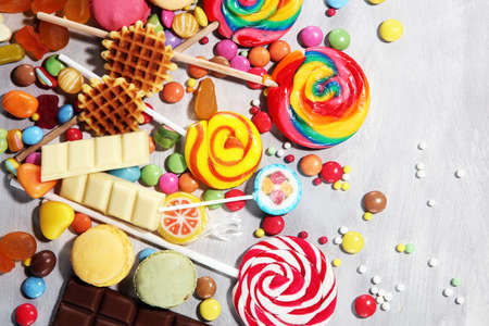 candies with jelly and sugar. colorful array of different childs sweets and treats.の写真素材