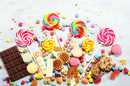 candies with jelly and sugar. colorful array of different childs sweets and treats.の写真素材