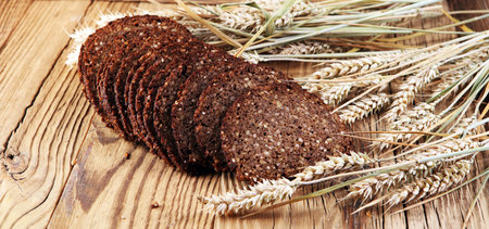 bread on wooden board from above. Kitchen or bakery poster design.