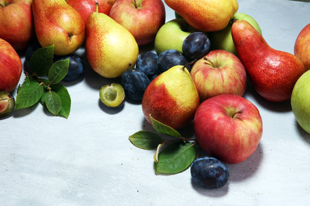 Various fresh fruits. Thanksgiving apples, and pears on rustic background