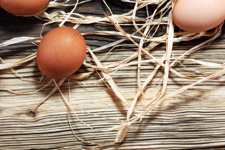 Egg. Fresh farm eggs on a wooden rustic background.の写真素材
