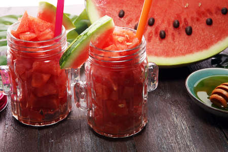 Tasty fresh appetizing watermelon drink smoothie. Watermelon drink in glasses with slices of watermelonの写真素材