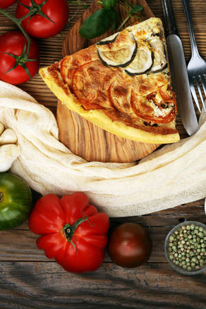 Homemade Cheesy Egg Quiche for Brunch with Spinach and Tomato, onions and zucchiniの写真素材