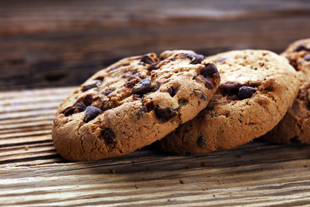 Chocolate cookies on wooden table. Chocolate chip cookies shot
