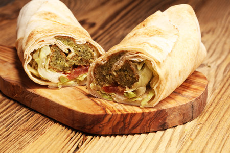 Green falafel with hummus and vegetables in pita bread. Love for a healthy vegan food concept