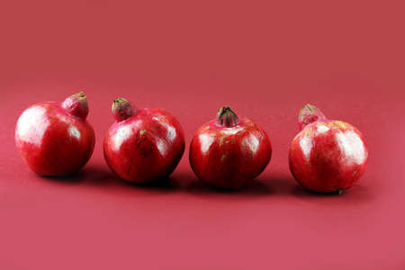 Ripe Pomegranates. whole pomegranate on a tableの写真素材