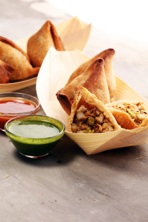 Vegetarian samsa or samosas.Indian special traditional street food punjabi samosa or Coxinha,...