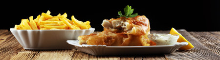 traditional British fish and chips consisting of fried fish, potato chips