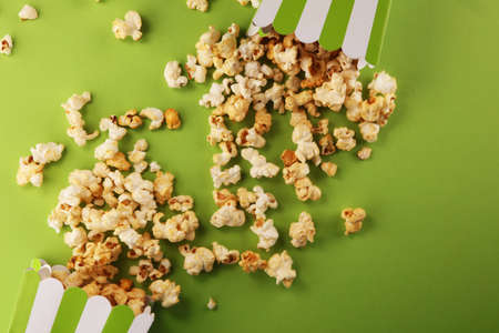Cinema concept with popcorn in green white bagの写真素材