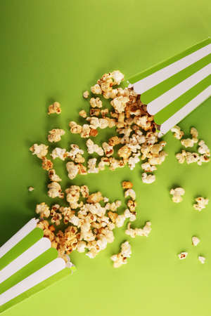 Cinema concept with popcorn in green white bagの写真素材