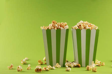 Cinema concept with popcorn in green white bagの写真素材
