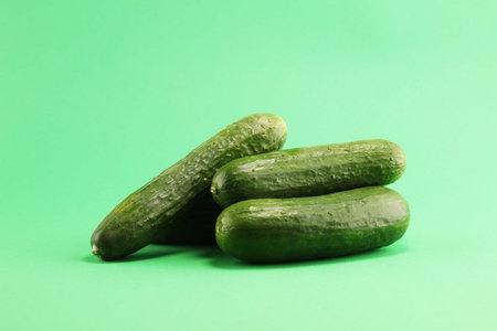Fresh cucumbers on green. cucumbers for diet and healthy eating