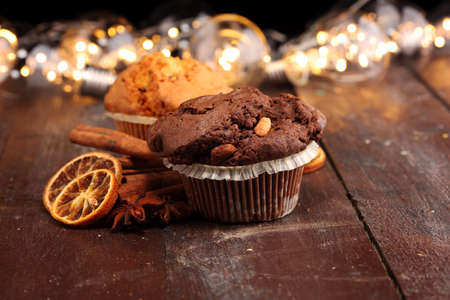 Chocolate muffin and nut muffin, homemade bakery on dark backgroundの写真素材