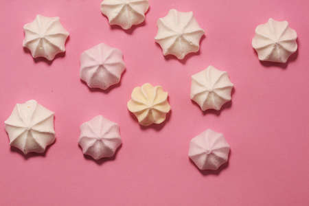 Meringue. Crispy white and pink twisted meringue. Concept love of sweetの写真素材
