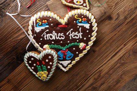 original bavarian christmas gingerbread heart on wood. xmas gingerbread cookieの写真素材