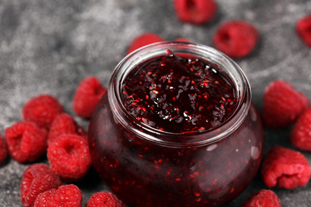 raspberry jam with fresh raspberries. marmalade in jar.の写真素材