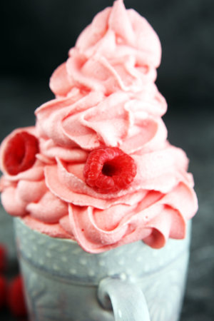 Healthy homemade raw vegan banana and berry ice cream (icecream, nicecream) topped with organic raspberriesの写真素材