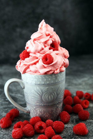 Healthy homemade raw vegan banana and berry ice cream (icecream, nicecream) topped with organic raspberriesの写真素材