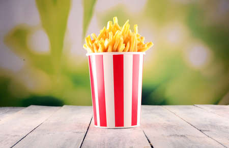 Potatoes French Fries in Red and white Carton Package Box. Fast Foodの写真素材