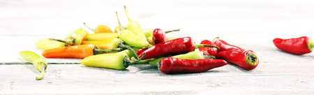 Pepper. Mexican hot chili peppers colorful mix habanero poblano serrano jalapeno on wood