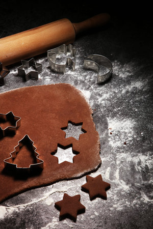 Baking christmas cookies. Typical cinnamon stars bakery for xmas with ingredients
