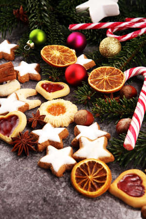 Decoration with christmas cookies. Typical cinnamon stars with fruits and nuts.の写真素材