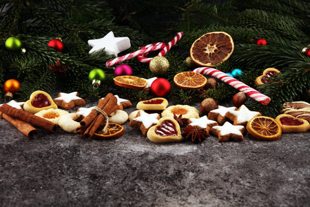 Decoration with christmas cookies. Typical cinnamon stars with fruits and nuts.